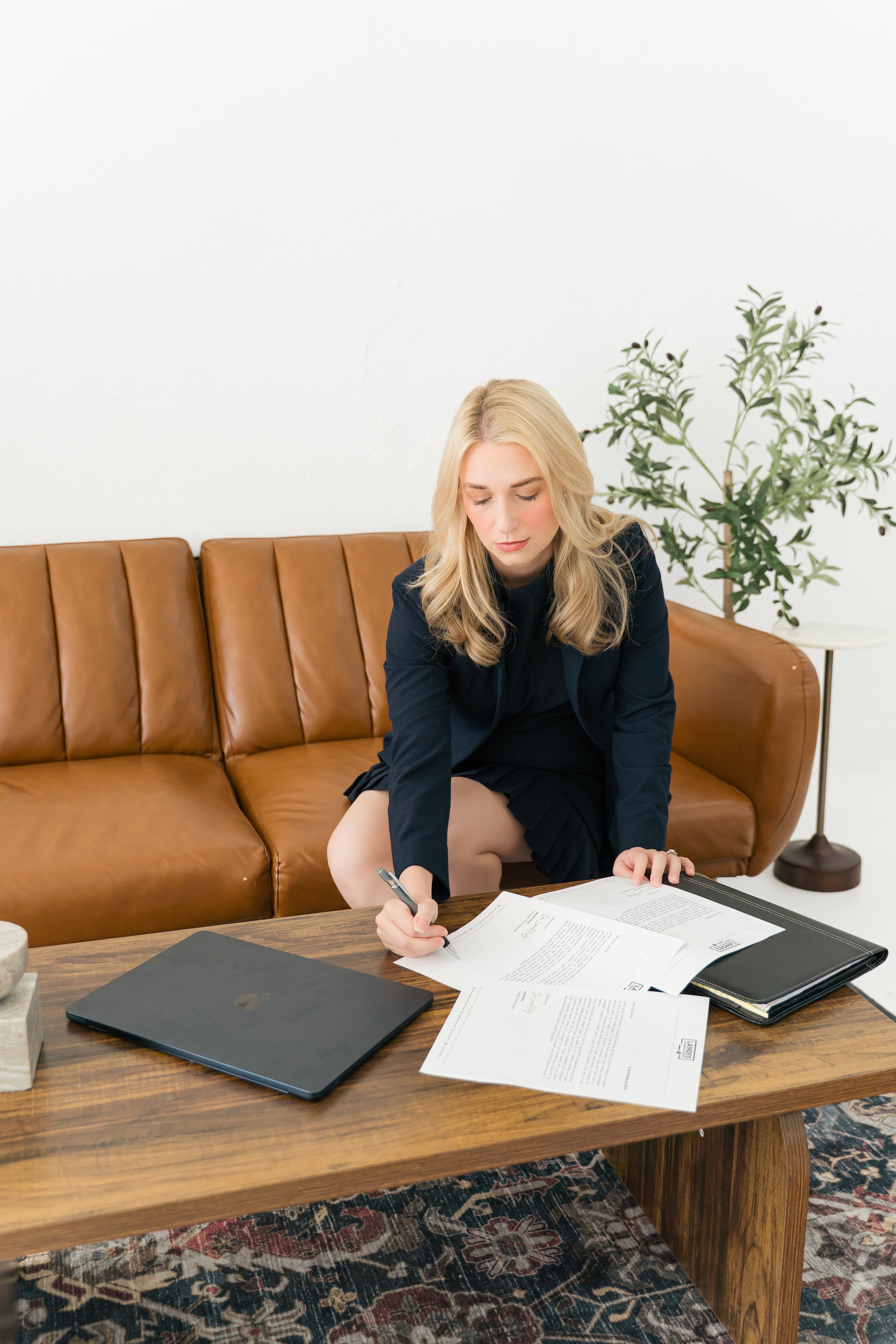Kaylind Landes reviewing case documents at a table
